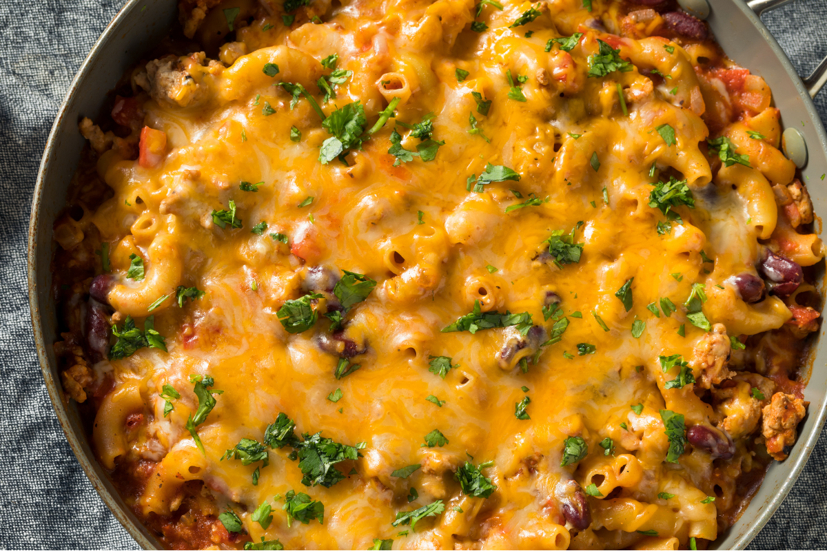 A creamy and cheesy homemade dish inspired by Chick-fil-A's mac and cheese recipe, served in a white bowl with a golden-brown top