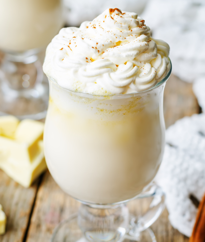 A bowl of homemade white hot chocolate mix with cocoa butter and powdered sugar, ready for a warm, creamy beverage